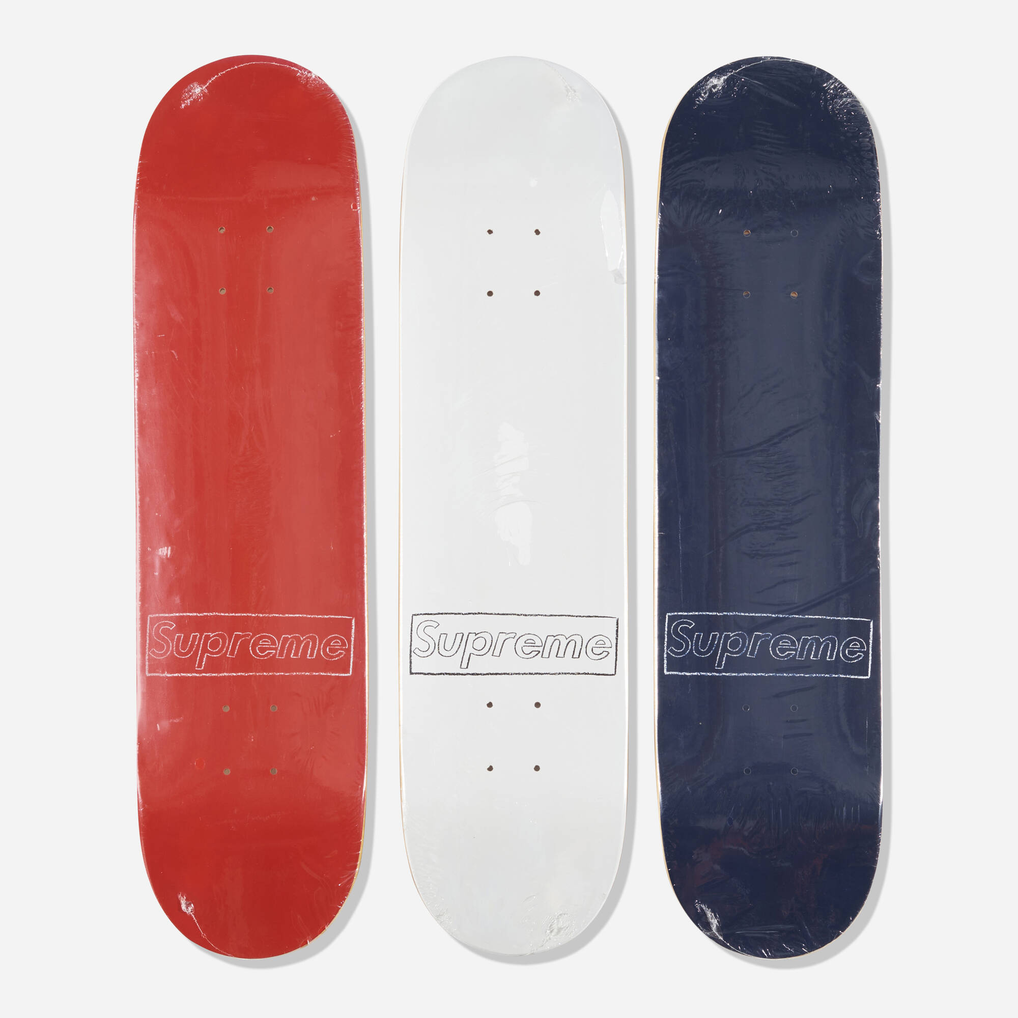 156: KAWS X SUPREME, Box Logo skateboard decks (Red, White and 